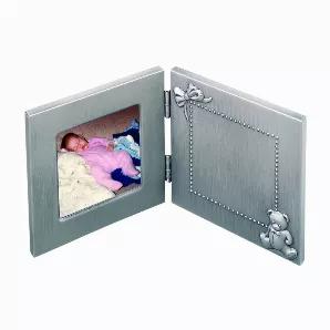 Our hinged baby frame is the perfect home that most precious first photo. One side of our non-tarnish pewter finish frame is accented with a teddy bear and bow. The 3" x 3" engraving area is defined by a beaded border and is the perfect size to engrave whatever your desired message is. The opposite side holds a 3" x 3" square photo of your new arrival. Overall measurements when fully opened are 9.75"L x 4.75"H. This frame includes hooks that allow the piece to be hung on a wall as well. White gi