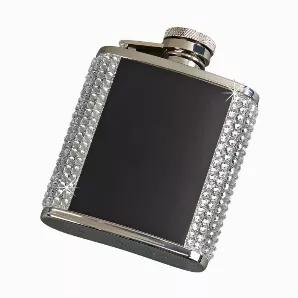 Add some Bling to your fling with our dazzling Crystal Flask with a black plated front and back (as is or perfect for optional engraving)! Each flask is bejeweled to a glittering sensation and holds 2.5oz of your favorite drink. And no worries about losing the cap because it is attached to the flask with a hinge. Fits flawlessly in your purse or pocket. Perfect girlfriend gift for any occasion at any time or just to have for yourself. Overall measurement is 2.5" wide x 3.5" high. Gift Boxed.