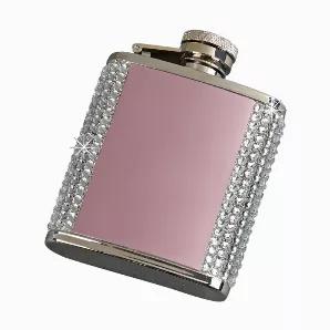 Add some Bling to your fling with our dazzling Crystal Flask with a pink plated front and back (as is or perfect for optional engraving)! Each flask is bejeweled to a glittering sensation and holds 2.5oz of your favorite drink. And no worries about losing the cap because it is attached to the flask with a hinge. Fits flawlessly in your purse or pocket. Perfect girlfriend gift for any occasion at any time or just to have for yourself. Overall measurement is 2.5" wide x 3.5" high. Gift Boxed.