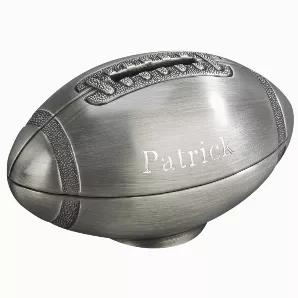 Get into the savings game with our non-tarnish brushed pewter finish football bank. The coin slot is right in the middle of the laces on the ball and there is plenty of room to engrave all the information you could want on either side of the laces. Overall dimensions are 2.25" H x 4.25" L x 2.5" W. White gift box.