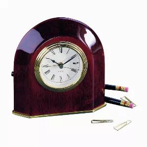 Our classic wood arch alarm clock has a rich, piano finish to go along with the gold accented face, base and backing. The clock features Quartz movement and requires one AAA battery (not included). Overall dimensions of the clock are 5.5" x 5.25". The front of the clock features an area measuring 3.5" x 1.25", which would be ideal for optional laser engraving. Black gift boxed.