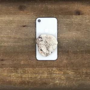 <p>Grip your phone in style with natural stone. </p>
<p>No two grips are the same as <strong>each stone has its own unique shape, size, and slight color differences. </strong></p>
<p>Use this amazing collapsible stone phone grip for multiple uses.  Attach this natural stone phone grip directly to your phone or your phone case for easier grip, taking photos with one hand, propping your phone, or wrapping your headphones.  Grip can easily be removed and reapplied. It will not ruin your phone or ph