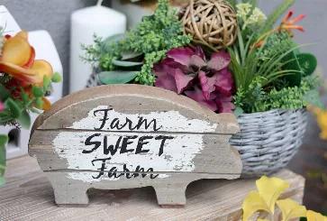 Nothing says you love your home more than Farm Sweet Farm Wood Pig!<br> This adorable wood brown cut-out of a pig has white paint brushed over it and the text is in black.<br> Enjoy your farmhouse lifestyle and set this cutie out on any counter, table, or desk!<br> This is a great gift choice for your friends and families, or anyone who loves farmhouse or rustic style Decor.<br> <br> Size: 9.5 x 1.25 x 5.5 inches<br> Material: Fir + MDF<br>