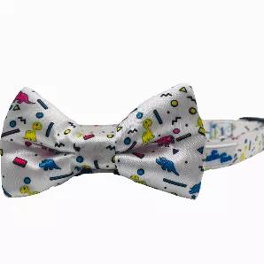 <p>Let's travel back to prehistoric times...and the 90s with this retro dinosaur bow tie. </p>
<p>All bow ties are 2" x 4" and fasten securely over any dog collar easily with the two elastic loops on the back of the bow tie - as seen in pictures. *Collar not included.</p>