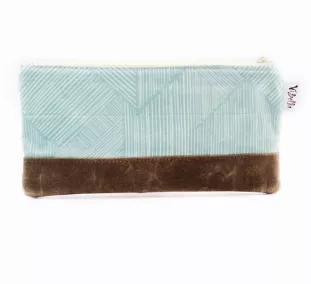 <p>Named after our 'rockstar' Haitian sewing team lead, the Dalguens Accessories Bag is the perfect size for your essentials! Featuring a fun cotton aqua and white print with a waxed canvas bottom for reinforcement, you will use this bag for years to come.</p>

<p>Details: 4 1/2" (T) x 9" (W), cotton lining</p>