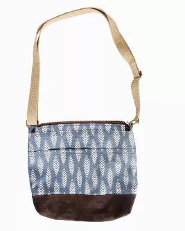 <div>Meet the perfect canvas cross body bag! Hand sewn by artisans in Haiti, this high quality bag is just the right size to carry all of your essentials!  The Julia Crossbody Bag has a 100% cotton adjustable strap, an inside pocket for little things that tend to get lost at the bottom of a bag and an outside pocket for quick access to your phone and/or keys.  </div>
<div></div>
<div>New for Spring 2022 - introducing three new colors/patterns to join the ever-popular original juniper green Julia