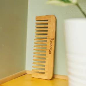 Bamboo Wide Tooth Detangling Comb
<br>
This natural bamboo comb works well on detangling and styling! Fits well in pockets for easy on-the-go. Wonderful for curly hair! 
<br>
Dimensions: <br>
5.5" length <br>
2" height <br>

Weight: <br>
.5 oz <br>

Ideal for: <br>
Zero waste/refill stores, gift stores, salons, spas, yoga centers, hospitality companies, realtors, Co- Ops, housewarming gifts, college send offs and so much more! <br>

Environmental Impact: <br>
Each plastic comb that has ever been