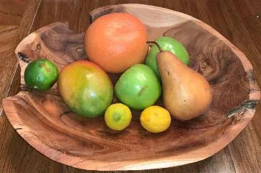 This Large Live Edge Bowl can be used as a catch all bowl, decoration, fruit bowl, or centerpiece. Each bowl is a unique piece and measures approximately 15" in diameter x 3" high. These bowls are rustic with live edges and a good amount of rustic charm.
