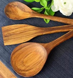 This rustic hand carved three piece teak utensil set is a beautiful and practical addition to any kitchen. Each three piece utensil set is hand carved from beautiful and durable Teak wood, giving it a rustic nice feel in your hand. Each set includes a medium spoon, large spoon, and spatula. Each utensil is 13" long and has a convenient hanging hole so they can be on display and within easy reach in your kitchen. The utensils are sealed with food-safe mineral oil for a beautiful finish.