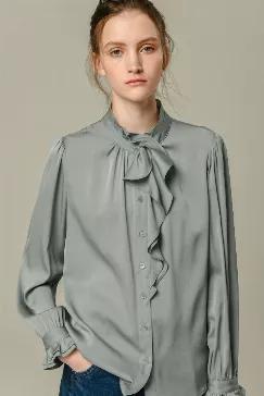 <p>Fabric: 91.8% Mulberry silk</p>
<p>            8.2% Spandex</p>
<p>Color: Green</p>
<p>Care: Hand wash or dry clean</p>
<p>  </p>
<p>This blouse is made of 100% silk and has a tie collar, front buttons closure, long sleeves with buttoned cuffs. </p>