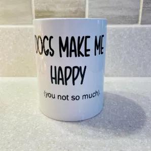 <ul>
<li>Dogs Make Me Happy (you not so much), COFFEE Mug</li>
<li>Holds approx 15 ounces of your favorite liquid</li>
<li>Mug is designed to have a handcrafted look</li>
<li>Measures 4.5" high</li>
<li>Comes with Gift Box</li>
<li>Material-Ceramic </li>
<li>Color-White</li>
</ul>