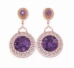 <p>Behold the beauty and splendor of this sparkling swirl design from <strong>Canari Jewels</strong> ! Fashionable and feminine, these gemstone and simulated diamond earrings are an exquisite anytime look. Crafted in precious 925 sterling silver, each earring features natural amethyst stones wrapped in a sparkling simulated white diamond. So engaging, these omega-back earrings captivate with 4.00 ct. t.w. of simulated diamonds.</p><div><h3>Drop Earring Details</h3><ul><li>Metal: 925 Sterling Sil