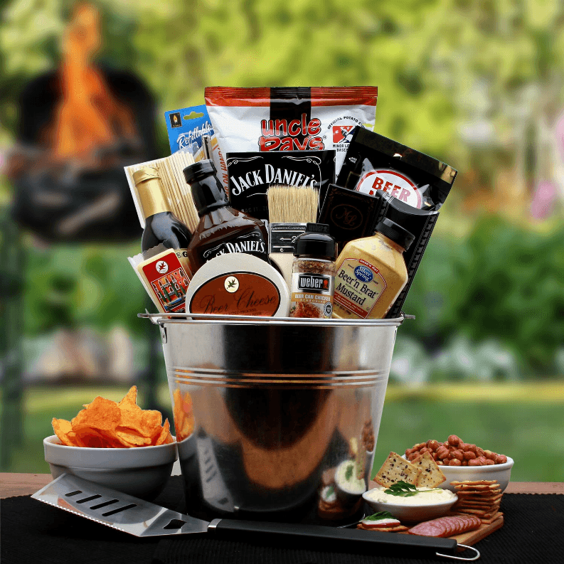 There's a line that separates the true grill masters from the amateurs. Our BBQ Lover's Pail is only for the true grill master. We've included some tried and true ingredients to deliver the optimum flavors in BBQ as well as few tasty treats for the master to gnaw on while he's working his magic! The BBQ Lovers Gift Pail includes: 10" galvanized pail for ashes, or his beers if he prefers, Beer Can chicken seasoning which along with a beer makes the juiciest most flavorful chicken ever, Jack Dania