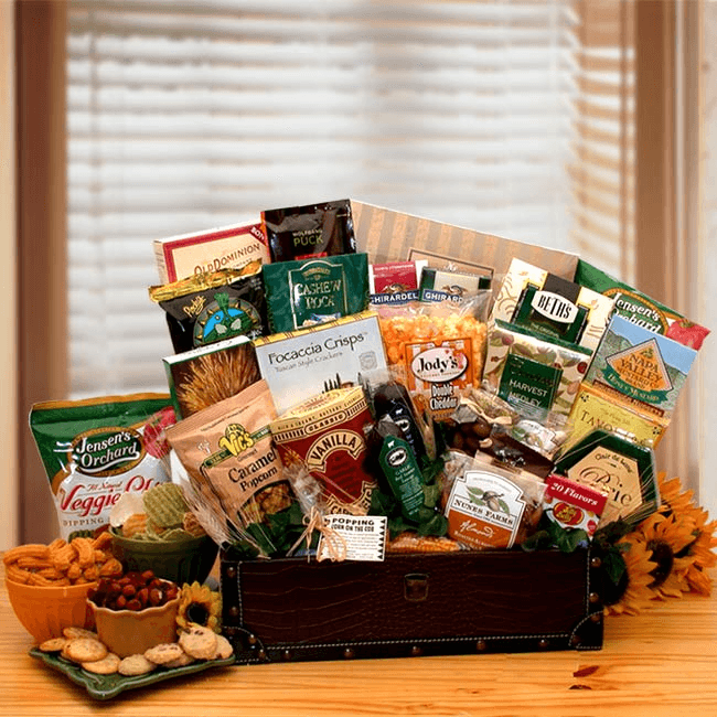 The Gourmet Snacking Favorites Chest includes: A handsome executive traveling chest with antique brass accents, caramel corn, 7 oz salami, 7 oz Smokey beef sausage, salted almonds, Old fashioned vanilla caramels, chocolate chip cookies, salty snack mix, creamy Brie cheese spread, Jelly Belly beans, stone wheat crackers, kettle cooked chips, Focaccia Parmesan crisps, Cheddar popcorn, cranberry trail mix, chocolate chip cookies, honey mustard pretzel nuggets, Tomato basil vegetable chips, Wolfgang