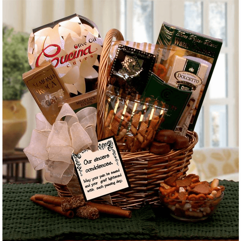Encourage a loved one who's suffered a loss when you send this graceful, gift basket made of fine, hand-woven gold willow that says you're thinking of them. The thoughtful card is sure to let them know they are in your thoughts during this difficult time. The Our Sincere Condolences Gift Basket includes: Gold basket, Almond Roca chocolate toffee, Chamberry French truffles, Dolcetto cream filled wafer cookies, three pepper crackers, Olive oil Cucina bistro chips, honey mustard pretzels, gourmet s