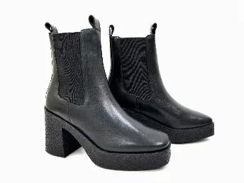 <p>New square-toe high heeled Chelsea bootie featuring a customized shock-absorbing rubber heel made to provide lasting support for those long standing and walking days. </p>
<ul>
<li>Pull-up </li>
<li>Square-toe</li>
<li>Side elastic goring </li>
<li>Sock-absorbing rubber heel </li>
<li>Front and back pull tabs</li>
<li>Handmade </li>
</ul>
<p><strong>Composition:</strong></p>
<ul>
<li>Footbed: 100% Leather</li>
<li>Upper: 100% Leather</li>
<li>Lining: 100% Textile</li>
</ul>
<p><strong>Measure