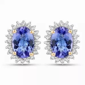 These halo Earrings provide the perfect amount of color for a subtle statement. 1.71 ct. t.w. oval tanzanite gemstones sparkle in their polished 14k yellow gold settings. Post with friction back, tanzanite Earrings for women.