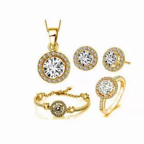 This Set of 5 consists of earrings, ring, pendant with chain and bracelet, all hand-assembled in Diamond CZs and pure Swarovski Crystals with shimmering Gold overlay.
The Diamond CZs in the front and center of this extraordinary set are surrounded with Swarovski Crystals on earrings, a ring, a necklace, and the bracelet band which is accompanied by four gold overlay horseshoes. This certainly gives an impression as if a Queen is arriving in a richly decorated Chariot. 
Get the Queen's Luck Set o