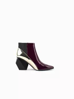 <meta charset="utf-8"><p data-mce-fragment="1"><meta charset="utf-8"><span>Go for a contemporary look in these marvelously modern ankle boots, that are sure to turn heads thanks to the structural block heel and allover eye-catching contrast color.</span></p><ul data-mce-fragment="1"><li data-mce-fragment="1">3.14'' heel</li><li data-mce-fragment="1">5.5" Shaft</li><li data-mce-fragment="1">11<span data-attr="shipDimensionsUnits">''</span><span> </span>circumference</li><li data-mce-fragment="1">