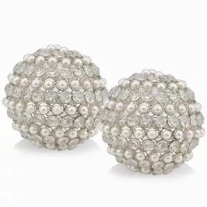 <p>The Facetas 5" Cristal &amp; Pearl Sphere makes an Elegant Statement in any Bowl. The Many Sparkling Crystals and Ivory Spheres nestled in a Nickel Plated Silver Frame Accentuates these Spheres. Sold in a Set of 2, these fillers are a Beautiful Addition to any Decor. Sold also in 4" &amp; 3" Diameters</p>