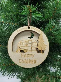 This 3d ornament will make a happy camper out of anybody. With three unique laser cut layers fused together to create a camping scene. Made of baltic birch wood, hanging ribbon included.  3.5" round