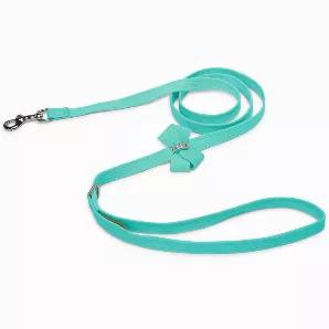 Elegance and functionality, this leash is a must have for your sweet pup!<br><br>Bow is embellished with rows of the world's finest cyrstals made in Europe<br>Made from Ultrasuede fabric with the soft texture and feel of premium suede.<br>Ultrasuede has the highest grade of durability, making this leash resistant to stains and discoloration<br>Snap hook with heavy plated nickel-silver finish<br>D-ring below the handle allows you to bring along your keys or pick up bags<br>Machine Wash, dry flat<