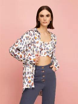 <p>Comfy button shirt with long sleeves and cuffs. Cropped top with elastic waistband and open back.</p>
<p>Solar Contrast: We are creating a brave new world with casual contrasts and complementary innovative forms. Leopard print has never been this functional before! Distressed leopard spots meet scorched orange in details.</p>
<p>53% Rayon 47% Viscose</p>
<p>Hand Wash Cold; Do Not Tumble Dry; Iron Low; Dry Clean</p>
<p>Do Not Bleach. Delicate Garment; Handle With Care.</p>
<p><span>HEIGHT </sp