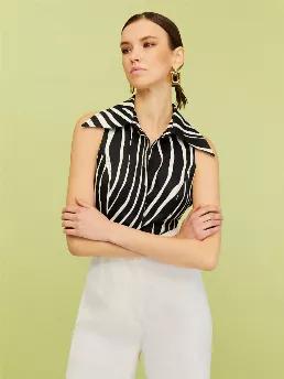 <p>Lapel collar cropped top with open back. Adjustable waistband. Front button closure.</p>
<p>Urban Aboriginals: A unique meld of black, white and purple juxtaposed with striking zebra stripes finds its way to elegant textures in classic suits and dresses. Time for a vision quest for urban aboriginals.</p>
<p>43% Rayon 41% Linen 16% Viscose</p>
<p>Hand Wash Cold; Do Not Tumble Dry; Iron Low; Dry Clean</p>
<p>Do Not Bleach</p>
<p>HEIGHT 179CM / BUST 75CM / WAIST 59CM / HIPS 87CM </p>