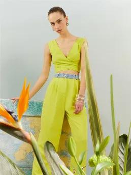<p>Wrap crop top with tie straps.</p>
<p>Reflections: Effortless style is always vibrant! We're in the flow along with the loudest and brightest colors! Pink, blue, acid yellow hues coupled with sparkly denim touches are the kind of luxury we are going for! Flowy chiffon dresses and solid suits will give you a style upgrade while comfy fits will elevate your mood.</p>
<p>74% Tencel Lyocell 26% Linen</p>
<p>Hand Wash Cold; Do Not Tumble Dry; Iron Low; Dry Clean</p>
<p>Dry Flat</p>
<p>HEIGHT 179CM