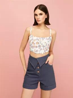 <p>High-waisted cuffed washed denim shorts with fold-over waistband and five pockets. Front metal button closure.</p>
<p>Solar Contrast: We are creating a brave new world with casual contrasts and complementary innovative forms. Leopard print has never been this functional before! Distressed leopard spots meet scorched orange in details.</p>
<p>98% Cotton 2% Elastane</p>
<p>Hand Wash Cold; Do Not Tumble Dry; Iron Low; Dry Clean</p>
<p>Do Not Bleach</p>
<p>HEIGHT 179CM / BUST 75CM / WAIST 59CM / 