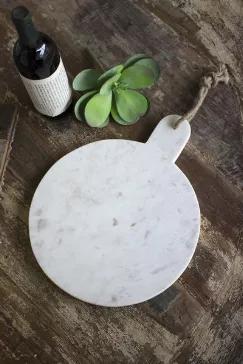This sleek white marble cutting board with jute hanger makes a stylish impression. Made in India, this hand-crafted serving board suits your serving and decorating needs.