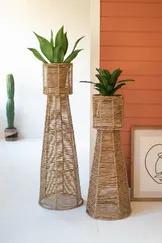 Crafted from natural seagrass, this set of two planter towers will elevate your garden! Adorn this duo with palms and other greeneries to spruce up your space.
