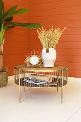 This metal and wood coffee table will add brilliance to your living area. The shiny table makes a catchy centerpiece for your living room, or you can use it as a low table for any seating area. You can display collections or store remotes and magazines with see-through storage underneath.
