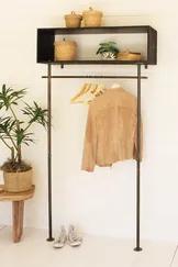 This tall metal shelf has open storage on top and hanging space beneath. Stack stuff on each layer of the top shelf and hang your coats, scarves, or clothes on the attached rod. Great for entryways or small closets.