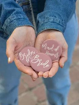 These super cute pinback buttons are 2.25 inches and fun for any wedding party occasion! Message what writing you would like.