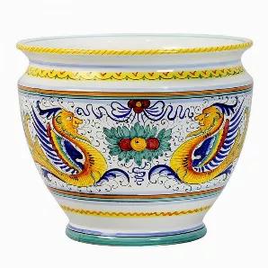 Among the most popular and enduring Italian majolica patterns, the classic 'Raffaellesco' traces its origin to 16th century, and the graceful arabesques of Raphael's famous frescoes.<br>The stylized dragon of the central motif was reputedly painted first by Raphael, a master painter and architect of the Italian High Renaissance.<br>Raffaellesco is a benevolent deity who bestows good luck and fair winds to seagoing merchants, thus the puffs of wind steaming from the dragon's mouth.<br><br>Our Raf