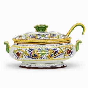 Among the most popular and enduring Italian majolica patterns, the classic 'Raffaellesco' traces its origin to 16th century, and the graceful arabesques of Raphael's famous frescoes.<br>The stylized dragon of the central motif was reputedly painted first by Raphael, a master painter and architect of the Italian High Renaissance.<br>Raffaellesco is a benevolent deity who bestows good luck and fair winds to seagoing merchants, thus the puffs of wind steaming from the dragon's mouth.<br><br>Our Raf