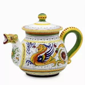 RAFFAELLESCO Collection: Among the most popular and enduring Italian majolica patterns, the classic Raffaellesco traces its origin to 16th century, and the graceful arabesques of Raphael's famous frescoes.<br>The stylized dragon of the central motif was reputedly painted first by Raphael, a master painter and architect of the Italian High Renaissance.<br>Raffaellesco is a benevolent deity who bestows good luck and fair winds to seagoing merchants, thus the puffs of wind steaming from the dragon'