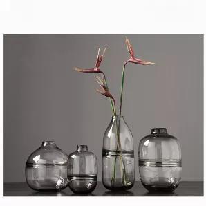 <div class="pd-new-desc info-box">
<div class="pd-new-desc info-box" data-mce-fragment="1">
<ul>
<li><span>Unique Hand Blown Vase for Modern Home Decor</span></li>
<li><span>Rounded curvature and dark clear glass finish are suitable for any modern house.</span></li>
<li><span>Crafted with care through a high-quality hand blow process, each piece is unique and size may vary slightly.</span></li>
</ul>
<p class="content" data-mce-fragment="1"><strong data-mce-fragment="1">Details:</strong></p>
</d