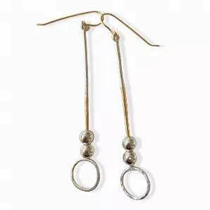 <ul>
<li>14k gold fill and sterling silver 2.5"? sticks finished with handmade sterling, hammered, hoops and two large moveable sterling beads. <br><br>
</li>
<li>Extremely lightweight </li>
</ul>