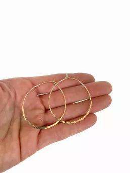 <p>You can"(TM)t spell Spring without Classic Hoop Earrings! </p>
<ul>
<li>18g </li>
<li>available in 14k gold fill, solid 14k gold ( please allow 7-12), and sterling silver </li>
<li>approx 1.75"? diameter </li>
<li>lightweight </li>
</ul>