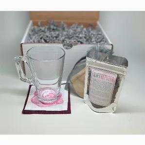 <p data-mce-fragment="1">Contents:</p><p data-mce-fragment="1">? 0.5 oz. Fujian Rose Green Tea (makes 5-10 cups)</p><p data-mce-fragment="1">? 8 oz. Glass mug</p><p data-mce-fragment="1">? 6 Natural paper drawstring tea bags</p><p data-mce-fragment="1">? Printed fabric art coaster</p><p data-mce-fragment="1">HHPLIFT tea sets are a collaboration between the LIFT Workshop and two refugee resettlement groups. Program associates of RefuTea packed the tea; graduates of the Refugee One sewing studio c