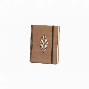 <p>The covers of this unique journal are upcycled plywood and laser engraved with a decorative leaf design. The inside is filled with handmade paper. Elastic band closure. Measures approx. 5.5" x 4.5" x 1.25". Handcrafted in Sri Lanka. Proceeds support Helping Hand Artisans, HHP's global artisan network.</p>