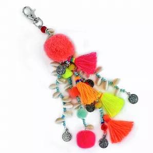 This bag charm has 6 different colors. Pom-poms and Tassels with turquoise beads and shells. Silver plated hardware.