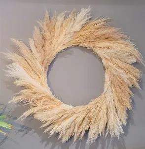 <p>Our wreaths are all hand made and made to order. Each Pampas Grass Wreath is made with premium pampas in mixed neutral tones to fit any decor style!</p><p>This wreath is made with mixed premium Pampas Grass in beige and white tones and measures 21" (inner ring)</p><p> <strong>Care: </strong><span>When you receive your new wreath give it a gentle shake (outside) to fluff up then lightly spray with hairspray. Ensure you are giving yourself a few inches between wreath and hairspray to avoid appl