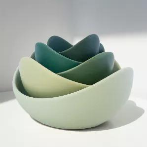 <p>Our ceramics team designed the Natalia Bowls with the shape of a lotus flower in mind. We wanted to create bowls that come alive in your room with beautiful, vibrant colors, and eccentric shapes that naturally nestle within each other. Whether you use these bowls to share meals with loved ones or as a sculptural centerpiece in your living space, we hope they bring the essence of Wabi Sabi to your home.</p>