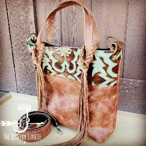 <p><span style="font-weight: 400;">Channel the spirit of the Southwest with this boho handbag from Jewelry Junkie! Featuring a bold, Navajo-inspired print, this crossbody bag is sure to leave an impression.</span></p>
<ul>
<li style="font-weight: 400;"><span style="font-weight: 400;">Made from genuine leather </span></li>
<li style="font-weight: 400;"><span style="font-weight: 400;">Fully lined</span></li>
<li style="font-weight: 400;"><span style="font-weight: 400;">Hidden Snap Closure</span></