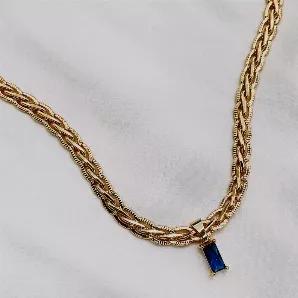 <p>This necklace gives off ultimate regal vibes mixed in with a touch of fun. Featuring a antique style snake chain and a royal blue cubic zirconia pendant, you are sure to turn heads with this unique piece. </p><p><meta charset="utf-8"><span>Water Resistant, Tarnish Resistant, Hypoallergenic</span></p><p><span>Material: </span></p><p><span>18K Gold Plated Stainless Steel</span></p><p><span>Cubic Zirconia</span></p><p><span>Length: 16inches + 5cm extender</span></p>