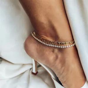 <p>This pre-layered anklet features 2 chains in 1, a figaro chain and a cubic zirconia tennis chain. Effortless and easy to throw on, this is sure to be a staple in your collection. </p><p>Material:</p><p>18K Gold Plated Brass </p><p>Cubic Zirconia </p><p>Water Resistant, Tarnish Resistant, Hypoallergenic</p>