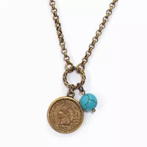 A Civil War era Indian Head Penny rests securely in a burnished gold bezel and hangs from a 24 inch open link chain with a 3 inch extender and lobster claw clasp. This earthy necklace includes a genuine 10mm turquoise bead. The copper coin is guaranteed to be dated from 1861-1865. A Certificate of Authenticity is included.